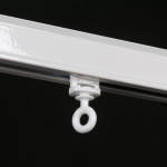 Бегунок-ролик поворотный «RT» с резиновым колесиком ø9 (ушко ø5,4 мм Белый)